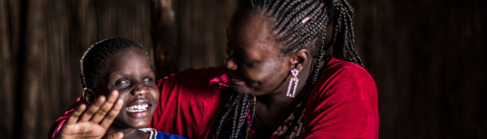 Teacher and visually impaired student during class.